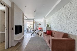 Televízia a/alebo spoločenská miestnosť v ubytovaní Hotel Italia Palace