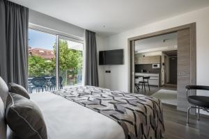 Posteľ alebo postele v izbe v ubytovaní Hotel Italia Palace