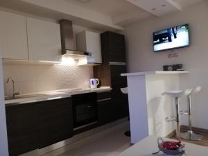 Kuchyň nebo kuchyňský kout v ubytování Apartman Škribulja