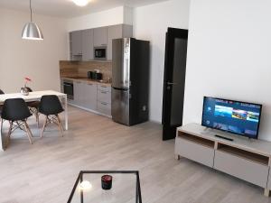 Kuchyň nebo kuchyňský kout v ubytování Prima Family Apartments