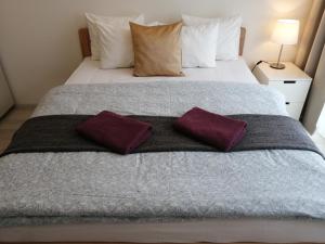 Postel nebo postele na pokoji v ubytování Prima Family Apartments