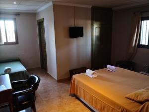 Posteľ alebo postele v izbe v ubytovaní Hotel Molino De Saydo