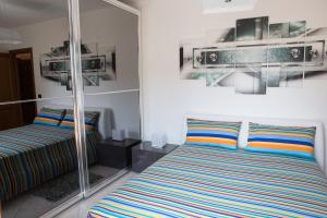 A bed or beds in a room at Viona Apartments