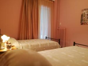 Postel nebo postele na pokoji v ubytování Platos Academy Apartment