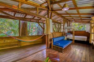 Postel nebo postele na pokoji v ubytování Omega Tours Eco-Jungle Lodge