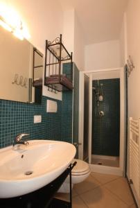 a bathroom with a sink and a toilet at B&B Residenza Bianco in Castellana Grotte