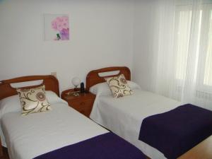 Postel nebo postele na pokoji v ubytování Hotel Abrego Reinosa