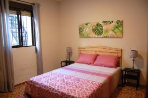 A bed or beds in a room at Casa de David