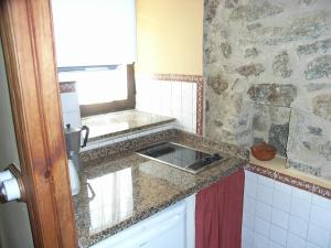 Kuchyň nebo kuchyňský kout v ubytování Casa Rural Jim Morrison
