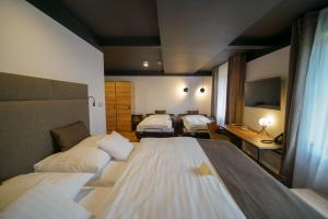 Postel nebo postele na pokoji v ubytování Grand Hotel BELLEVUE