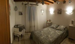 a bedroom with a bed and a table and a desk at Gites le Pimayon in Manosque +175 photos