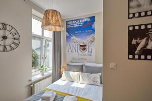 Łóżko lub łóżka w pokoju w obiekcie FLORIANSKA 32 by PI Apartments