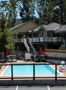 a swimming pool in front of a house at Fireside Lodge in Big Bear Lake
