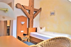 Postel nebo postele na pokoji v ubytování Hotel zum Bräu