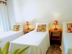 Cama ou camas em um quarto em Casa de Paixão Caraíva
