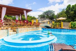 a large swimming pool with a water slide at Pousada Villa Real in Areia