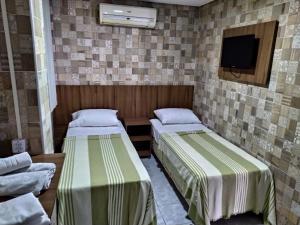 Ein Bett oder Betten in einem Zimmer der Unterkunft Hotel Campina Executivo