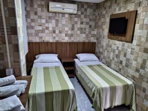 Katil atau katil-katil dalam bilik di Hotel Campina Executivo