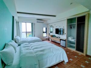 TV i/ili multimedijalni sistem u objektu Shell Sand Homestay