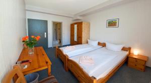 Postel nebo postele na pokoji v ubytování Hotel Atlantic
