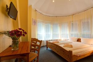 Postel nebo postele na pokoji v ubytování Hotel Atlantic