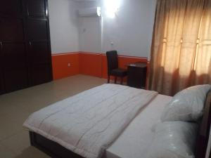 Ein Bett oder Betten in einem Zimmer der Unterkunft Tiffany Apartments