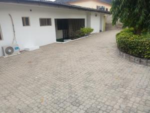 a brick driveway in front of a house at Tiffany Apartments in Ibadan