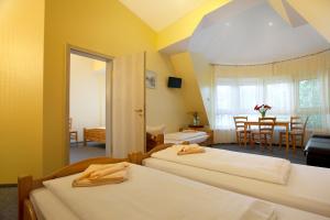 Postel nebo postele na pokoji v ubytování Hotel Atlantic