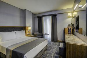 Postel nebo postele na pokoji v ubytování Hotel Venera Istanbul Old City + 37 fotografií