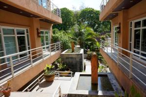 a courtyard of a house with a fountain at Silver Sands Resort - Koh Tao in Ko Tao