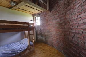 Dviaukštė lova arba lovos apgyvendinimo įstaigoje Het Torentje van Trips