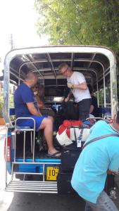 a group of people sitting in the back of a bus at Residence House in Trat