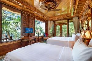 TV a/nebo společenská místnost v ubytování Coco Palm Beach Resort