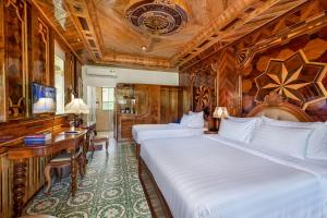 Postel nebo postele na pokoji v ubytování Coco Palm Beach Resort