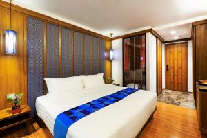 Postel nebo postele na pokoji v ubytování Lavana Hotel Chiangmai