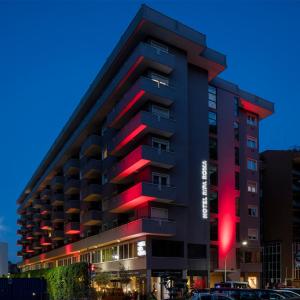 a building with red lights on the side of it at Hotel Ripa Roma in Rome