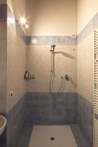 a bathroom with a shower with a toilet and a sink at La Corte D'Emilio B&B in Vignola