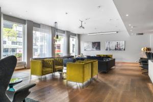 a living room with couches and chairs at Quality Hotel Residence in Sandnes