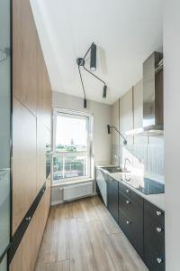 Kuchyňa alebo kuchynka v ubytovaní D Apartments Centrum Jurowiecka + 3 fotografie