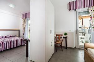 Postel nebo postele na pokoji v ubytování Hotel Vienna