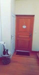 a red door with a sign on it in a room at la Casa D'estève in Bourges