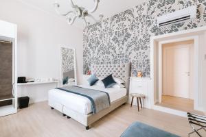 Letto o letti in una camera di Rhea Silvia Luxury Navona