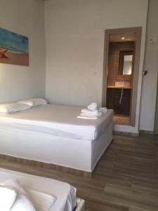 Postel nebo postele na pokoji v ubytování Aquarius Hotel