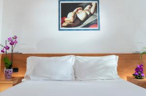 Postel nebo postele na pokoji v ubytování Aparthotel Esperya
