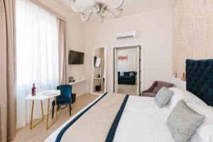 Letto o letti in una camera di Rhea Silvia Luxury Navona