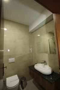 a bathroom with a sink and a toilet and a mirror at HOTEL IMPERIAL STRUGA in Struga +67 photos