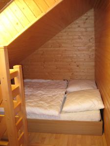 Tempat tidur dalam kamar di Penzión - Tempo