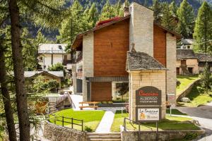 a house with a sign in front of it at Albergo Ristorante Cuccini in San Domenico