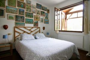 Кровать или кровати в номере Casa de Rilo ,para 6/8 en la Playa de Nerga