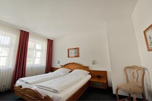 Voodi või voodid majutusasutuse Hotel Alt-Ringlein toas